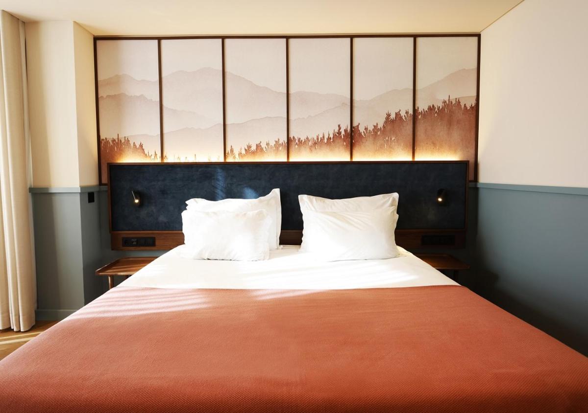 Uma cama ou camas num quarto em Montebelo Viseu Congress Hotel & Spa