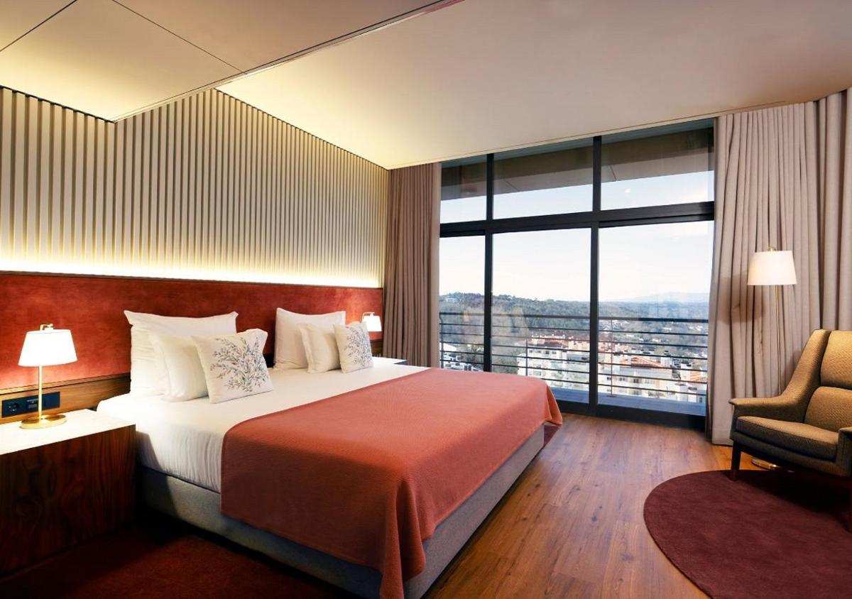 Uma cama ou camas num quarto em Montebelo Viseu Congress Hotel & Spa