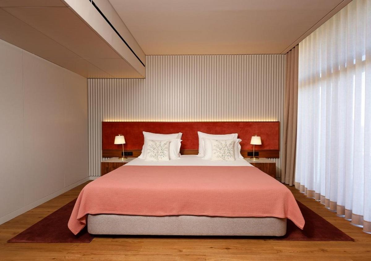 Uma cama ou camas num quarto em Montebelo Viseu Congress Hotel & Spa