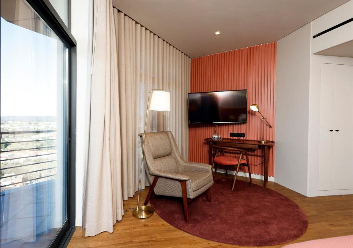 Uma televisão e/ou sistema de entretenimento em Montebelo Viseu Congress Hotel & Spa