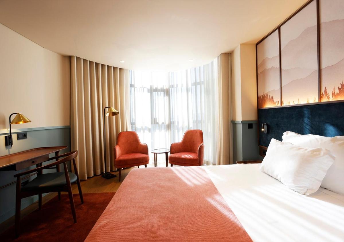 Uma cama ou camas num quarto em Montebelo Viseu Congress Hotel & Spa