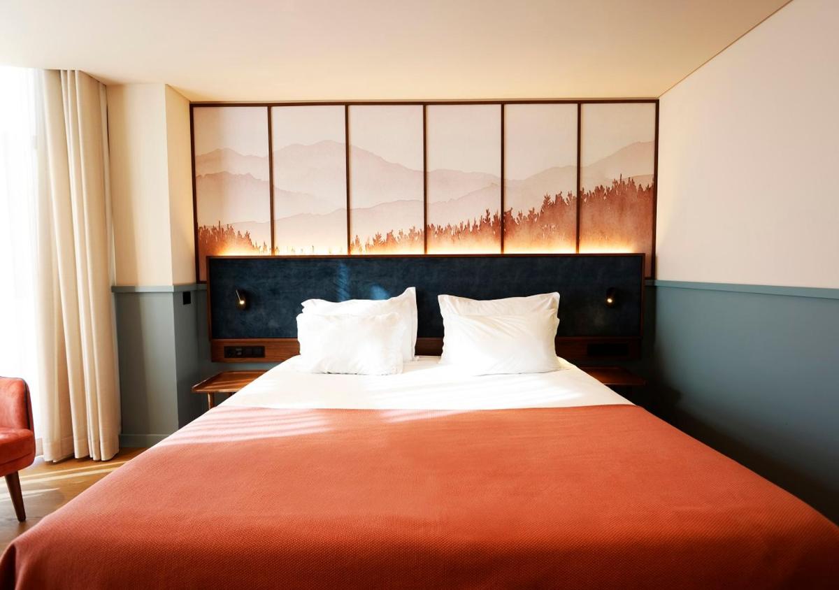 Uma cama ou camas num quarto em Montebelo Viseu Congress Hotel & Spa