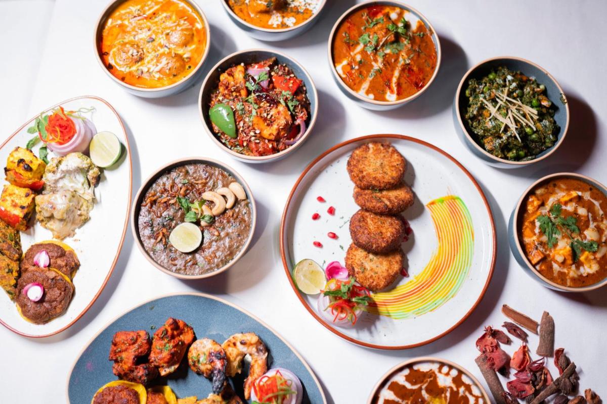 a group of plates of food on a table at Hyderabad Marriott Hotel & Convention Centre in Hyderabad