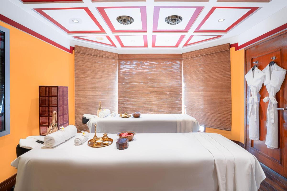 a room with two beds and a ceiling at Hyderabad Marriott Hotel & Convention Centre in Hyderabad