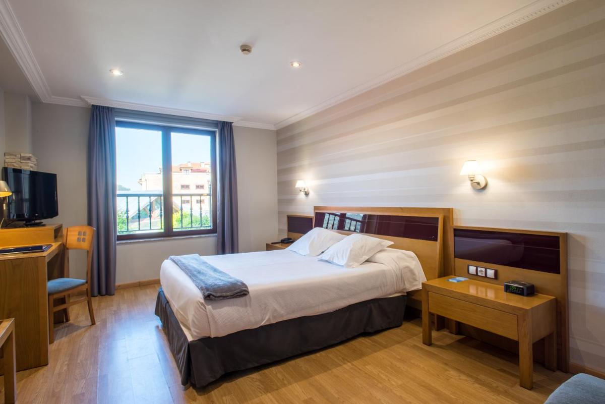 Cama o camas de una habitación en Hotel Spa Villa Pasiega