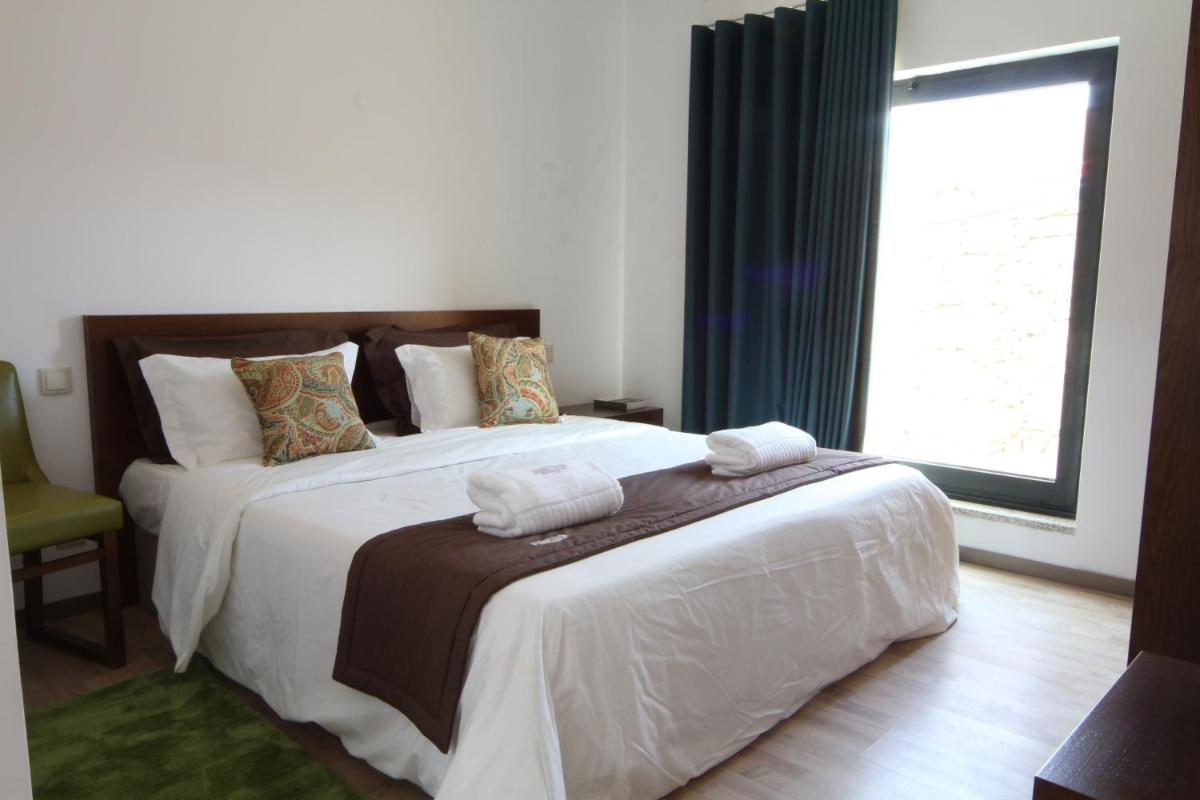 Uma cama ou camas num quarto em Douro Cister Hotel Resort