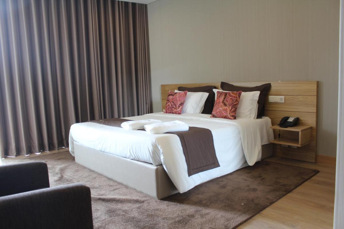 Uma cama ou camas num quarto em Douro Cister Hotel Resort