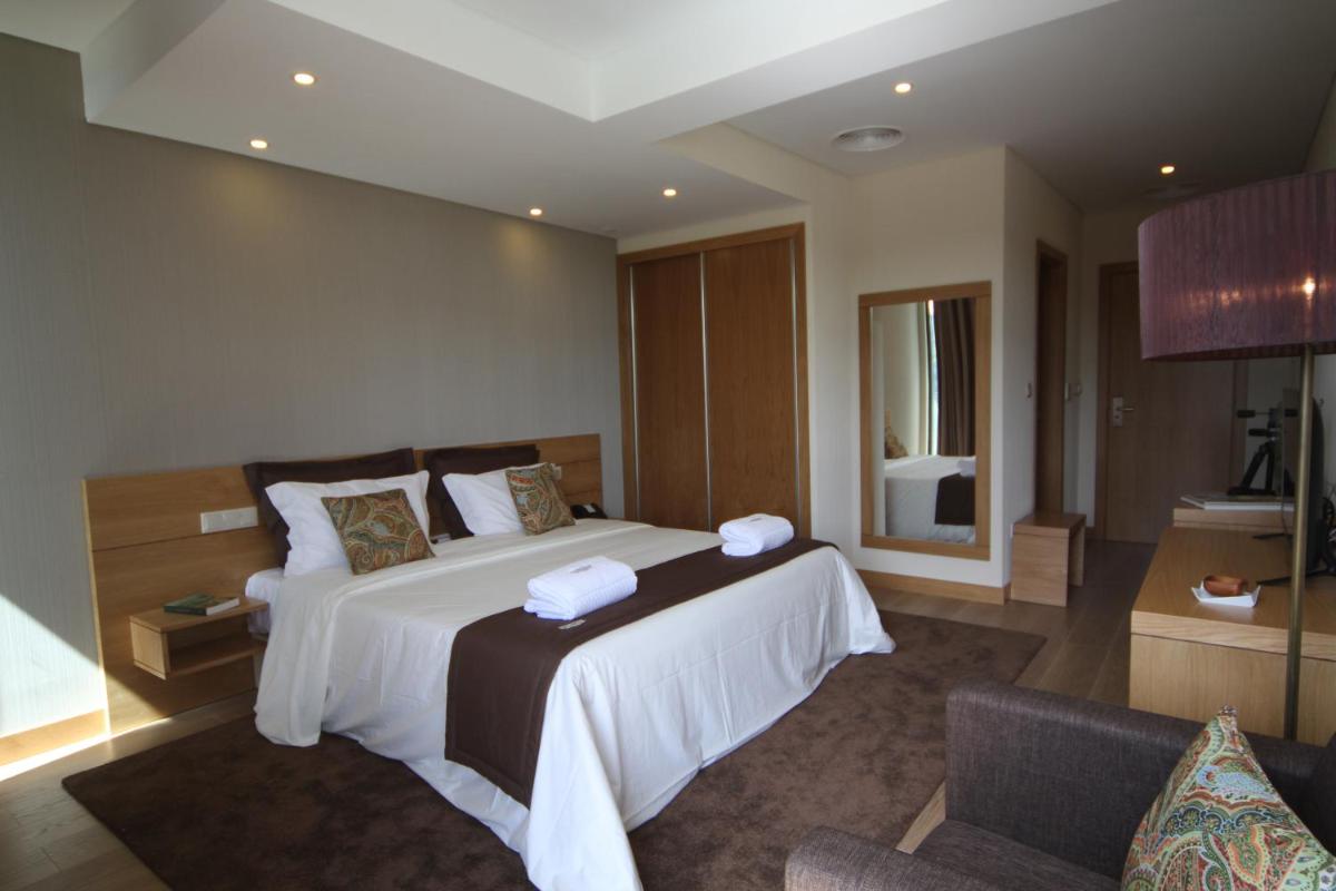 Uma cama ou camas num quarto em Douro Cister Hotel Resort