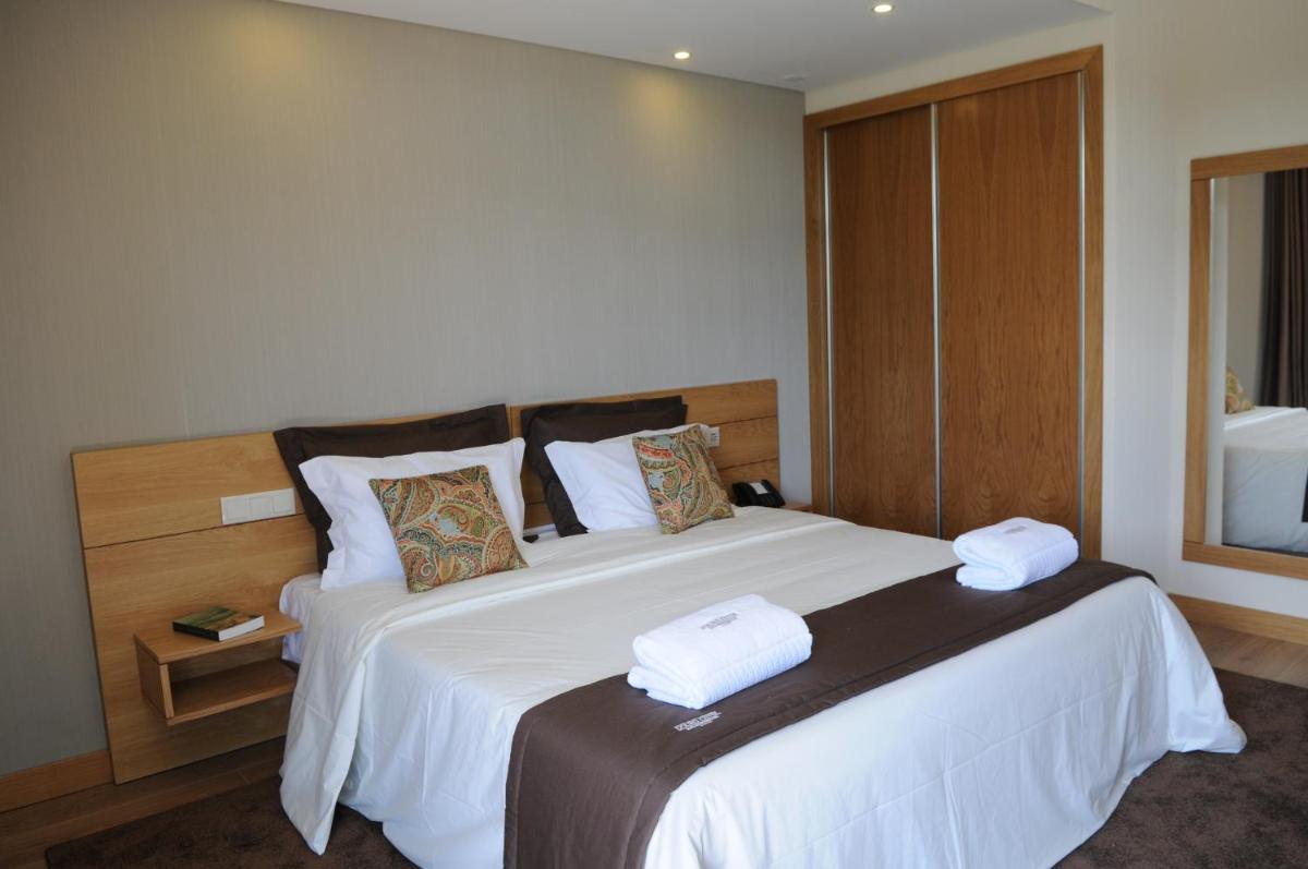 Uma cama ou camas num quarto em Douro Cister Hotel Resort