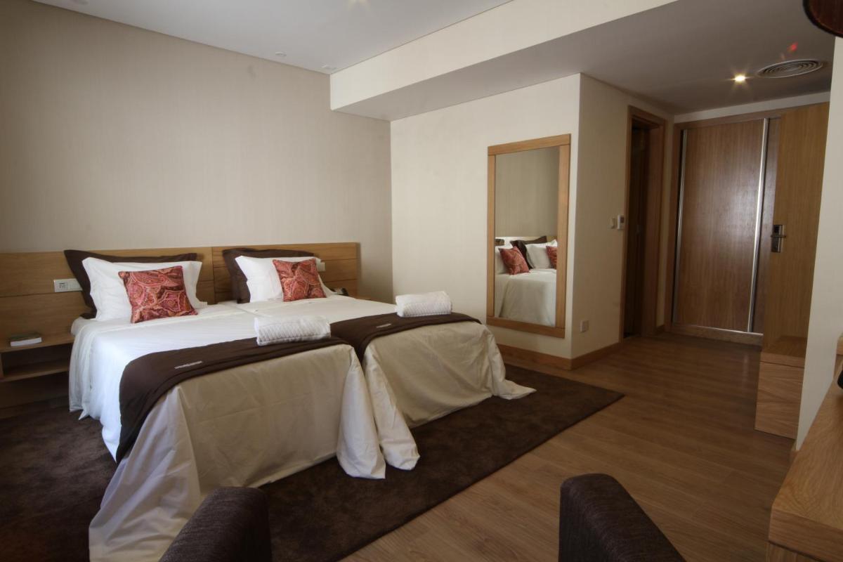 Uma cama ou camas num quarto em Douro Cister Hotel Resort