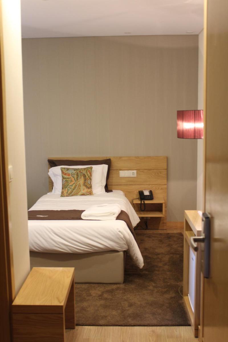 Uma cama ou camas num quarto em Douro Cister Hotel Resort