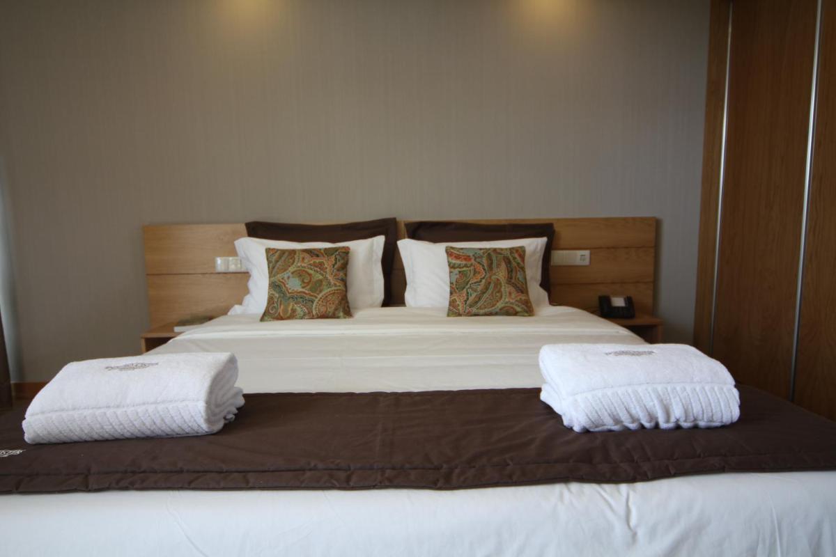 Uma cama ou camas num quarto em Douro Cister Hotel Resort