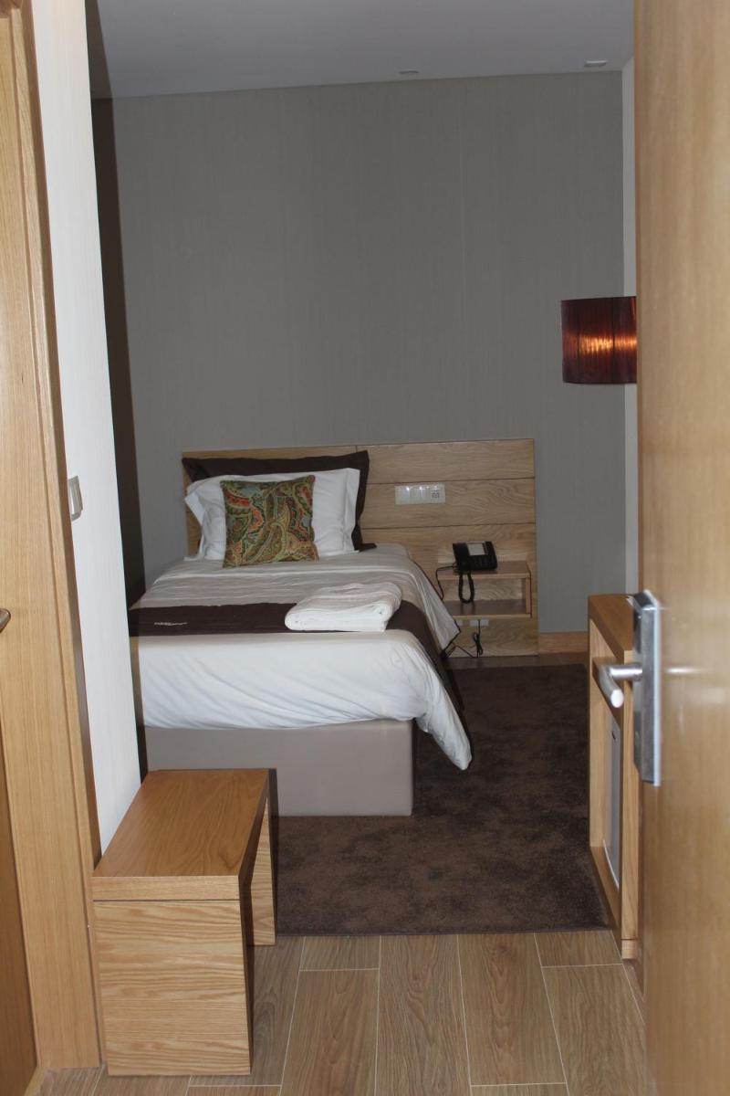 Uma cama ou camas num quarto em Douro Cister Hotel Resort