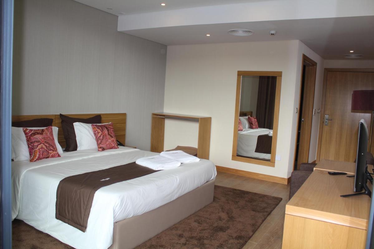 Uma cama ou camas num quarto em Douro Cister Hotel Resort