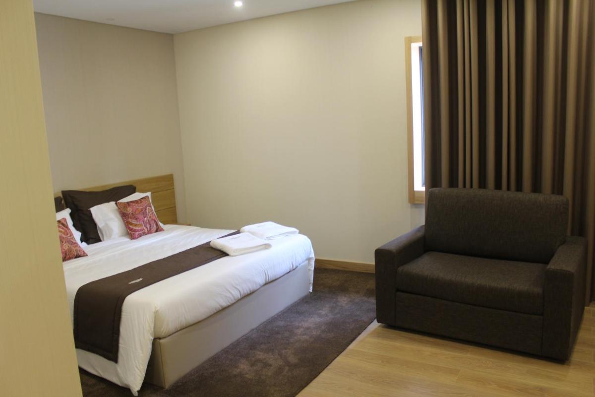 Uma cama ou camas num quarto em Douro Cister Hotel Resort