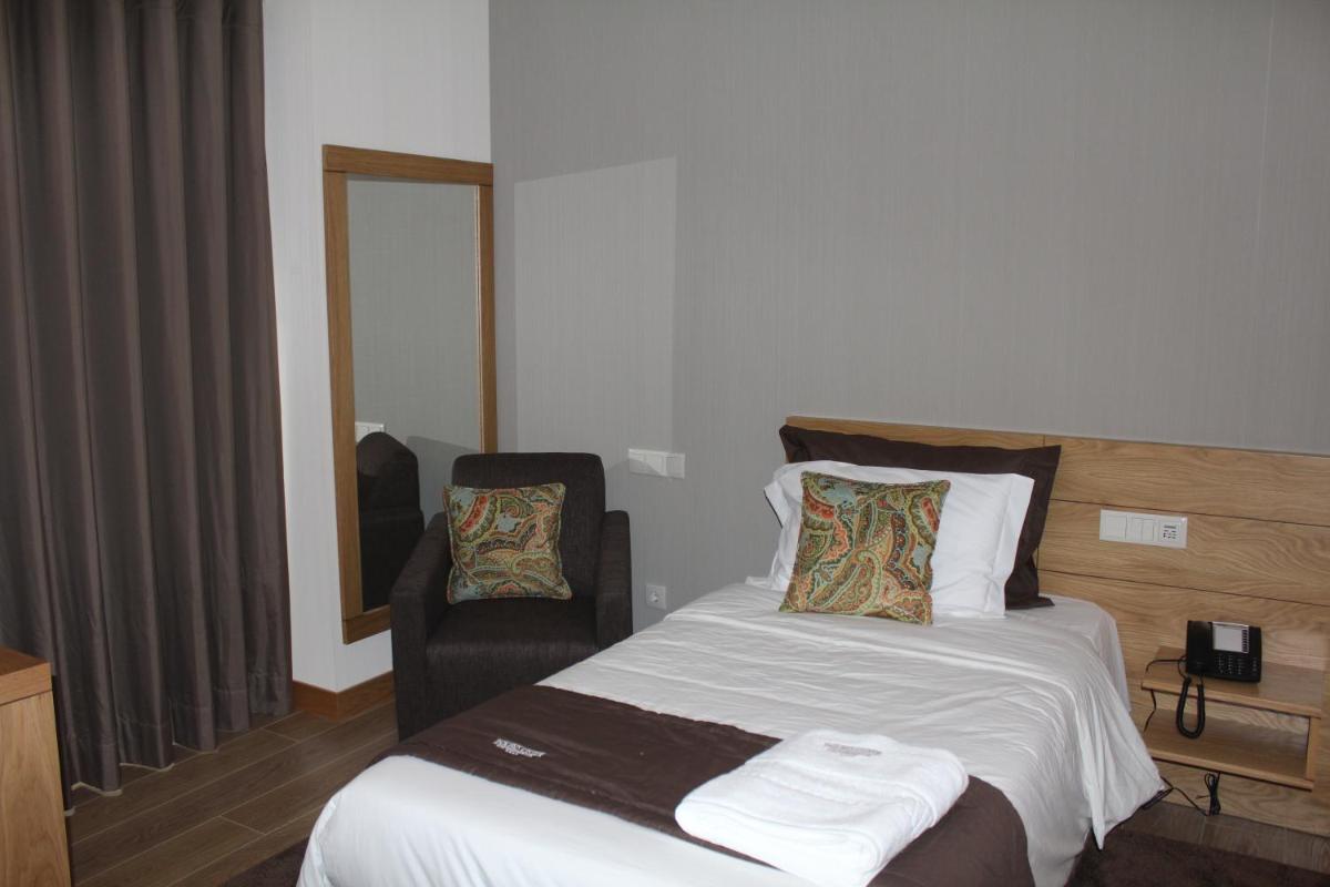Uma cama ou camas num quarto em Douro Cister Hotel Resort
