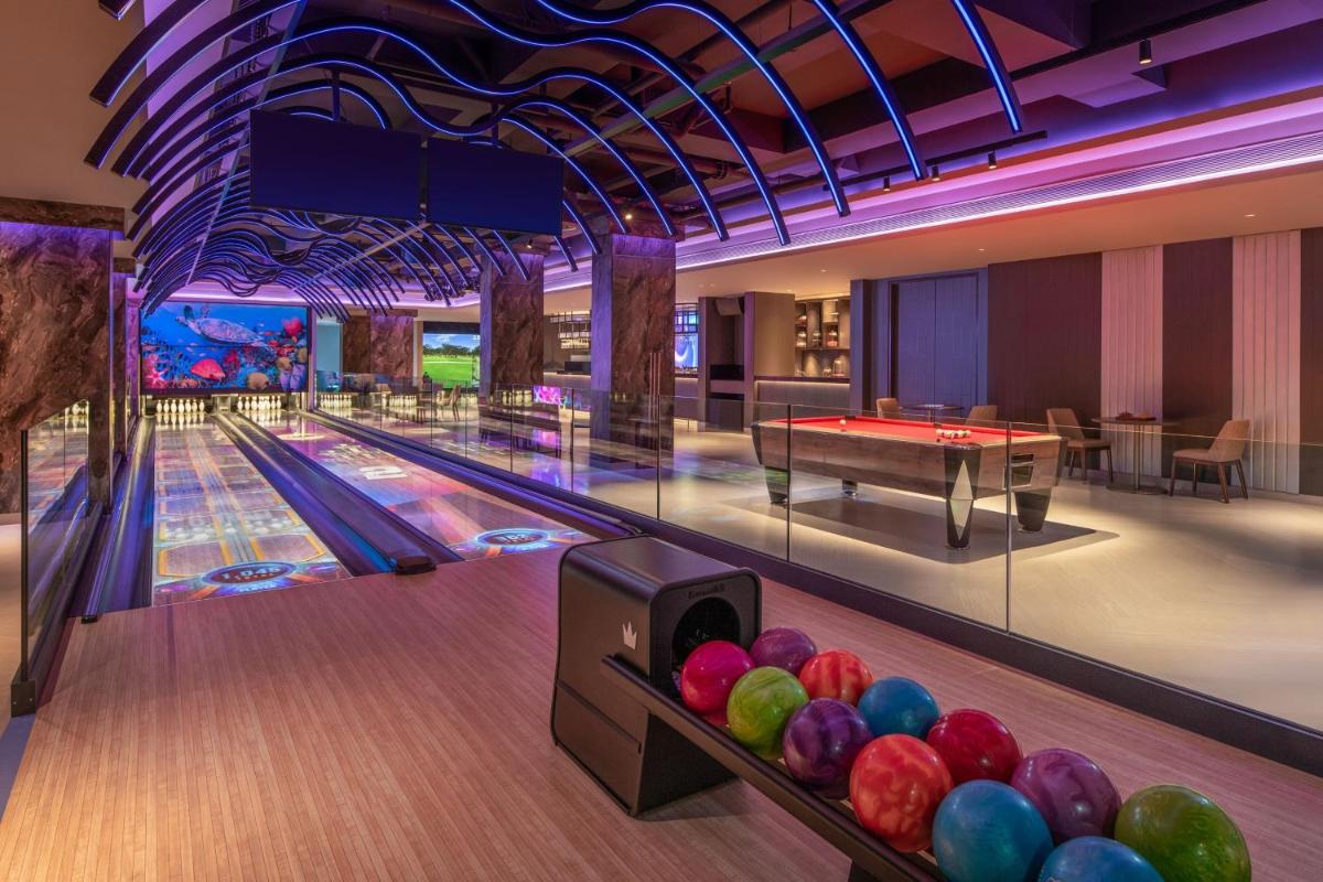 a bowling alley with balls on the lanes at JW Marriott Goa in Vagator a bowling alley with balls on the lanes at JW Marriott Goa in Vagator