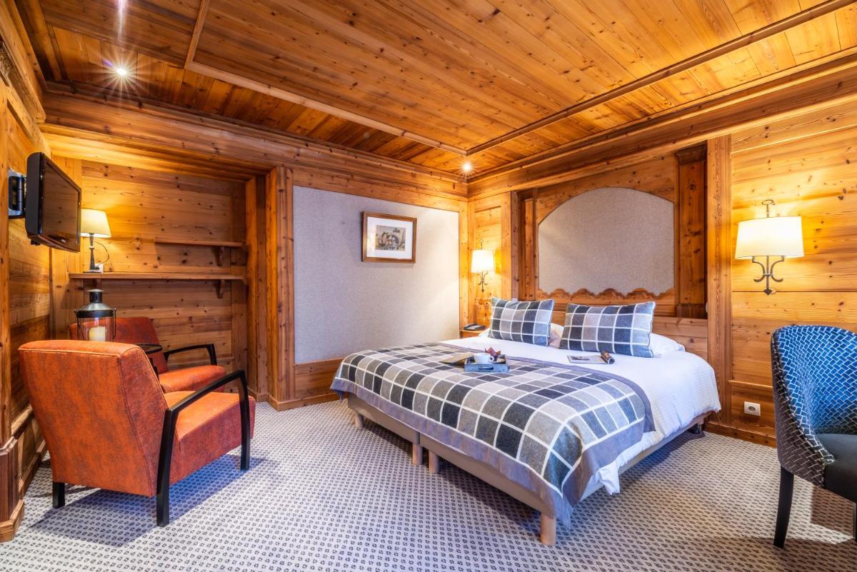 Un ou plusieurs lits dans un hébergement de l'établissement Hotel Le Samoyede