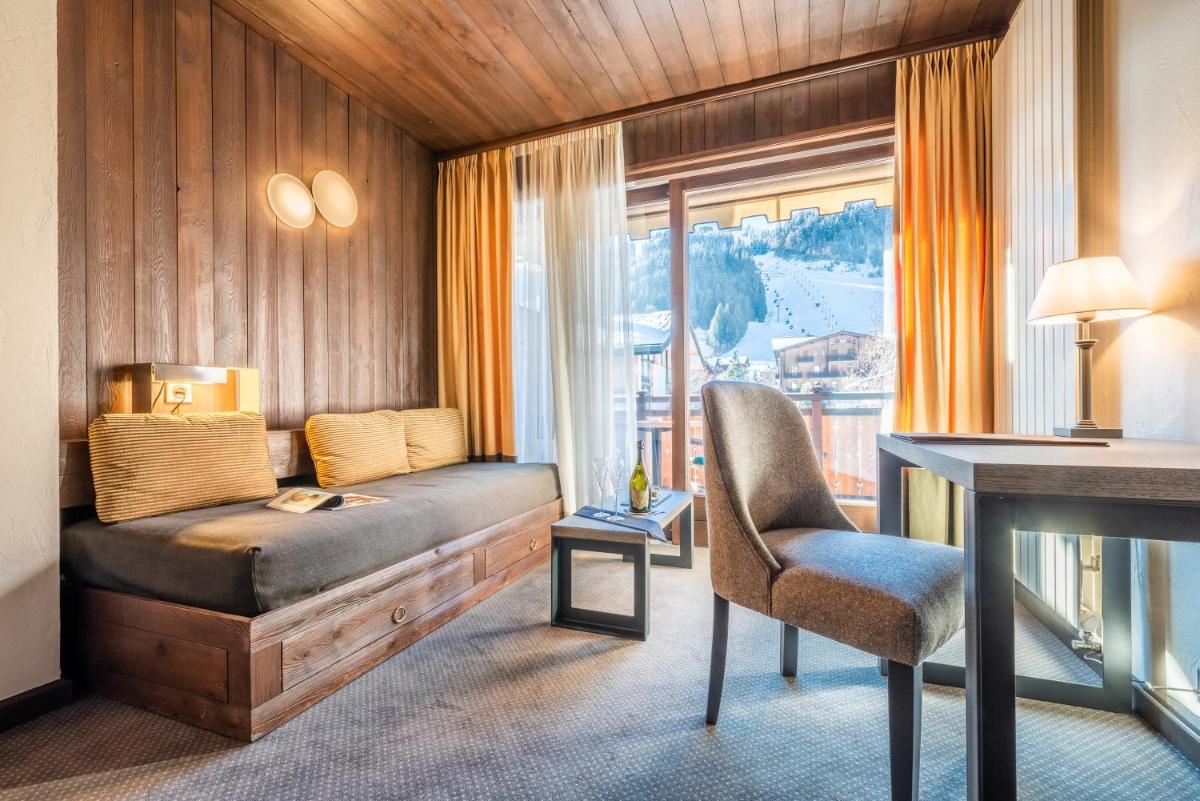 Un ou plusieurs lits dans un hébergement de l'établissement Hotel Le Samoyede
