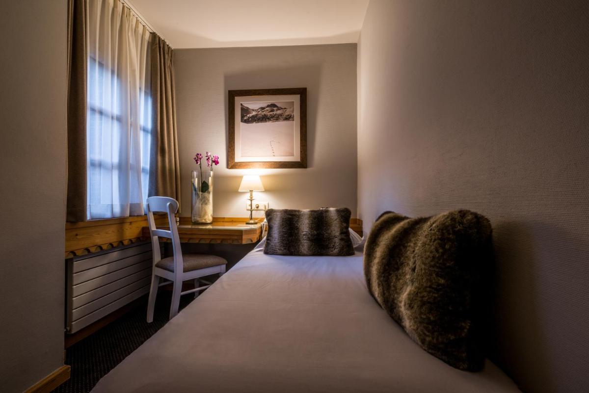 Un ou plusieurs lits dans un hébergement de l'établissement Hotel Le Samoyede