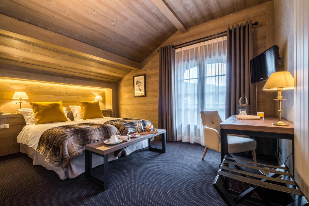 Un ou plusieurs lits dans un hébergement de l'établissement Hotel Le Samoyede