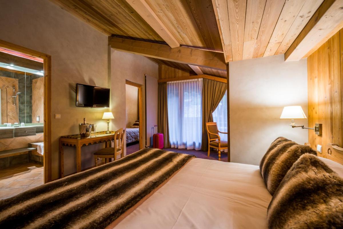 Un ou plusieurs lits dans un hébergement de l'établissement Hotel Le Samoyede