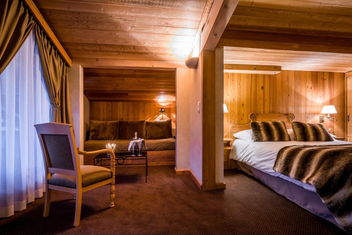 Un ou plusieurs lits dans un hébergement de l'établissement Hotel Le Samoyede
