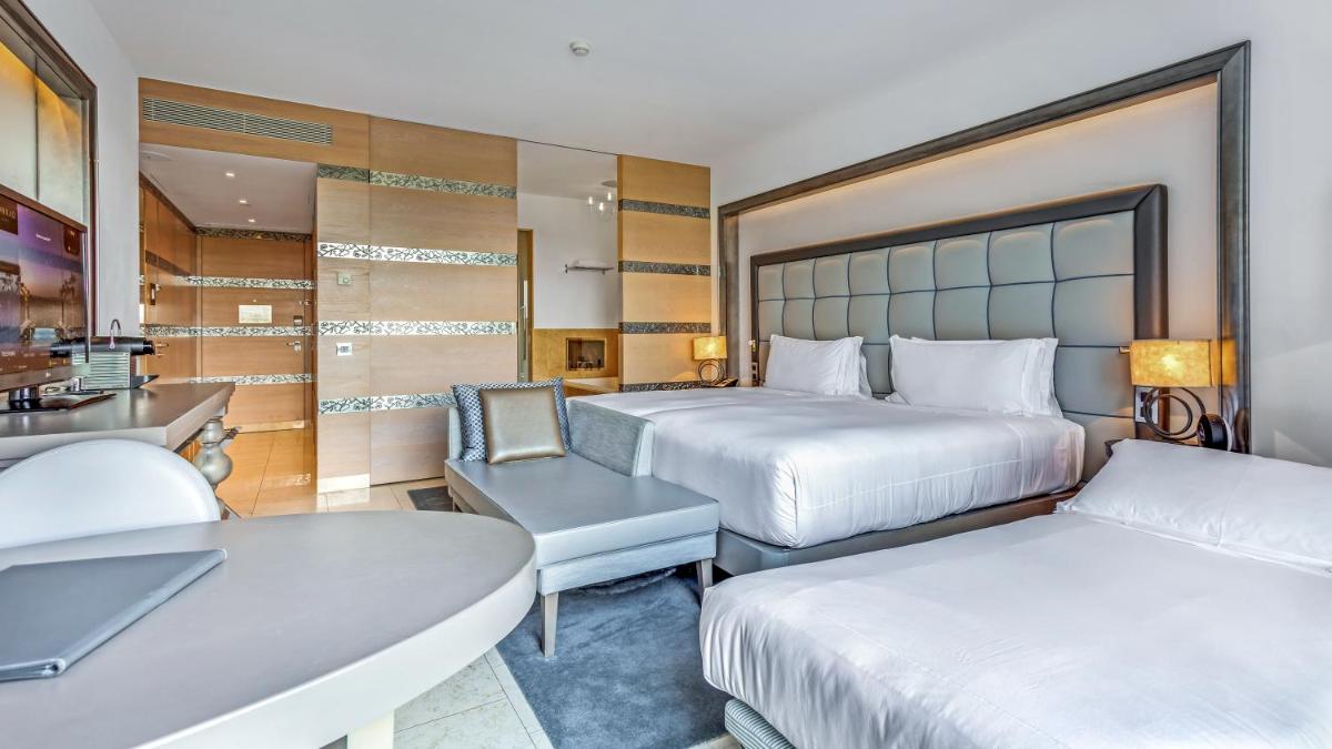 Uma cama ou camas num quarto em Conrad Algarve
