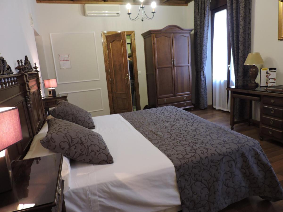 Cama o camas de una habitación en Hotel Palacio de Oñate