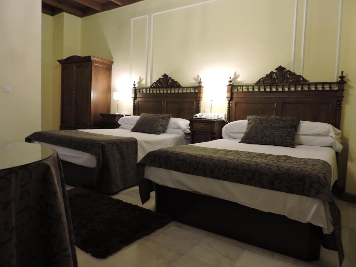 Cama o camas de una habitación en Hotel Palacio de Oñate