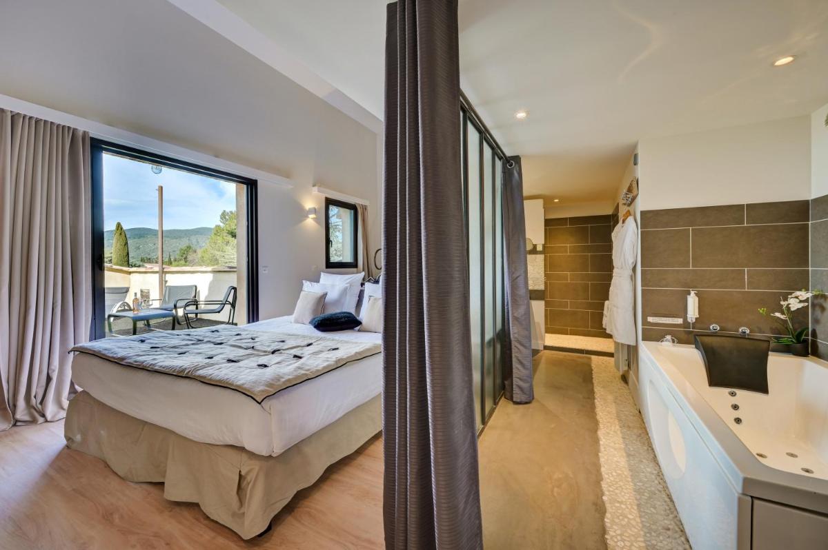Un ou plusieurs lits dans un hébergement de l'établissement Hotel Bastide & SPA - Villa de Lourmarin