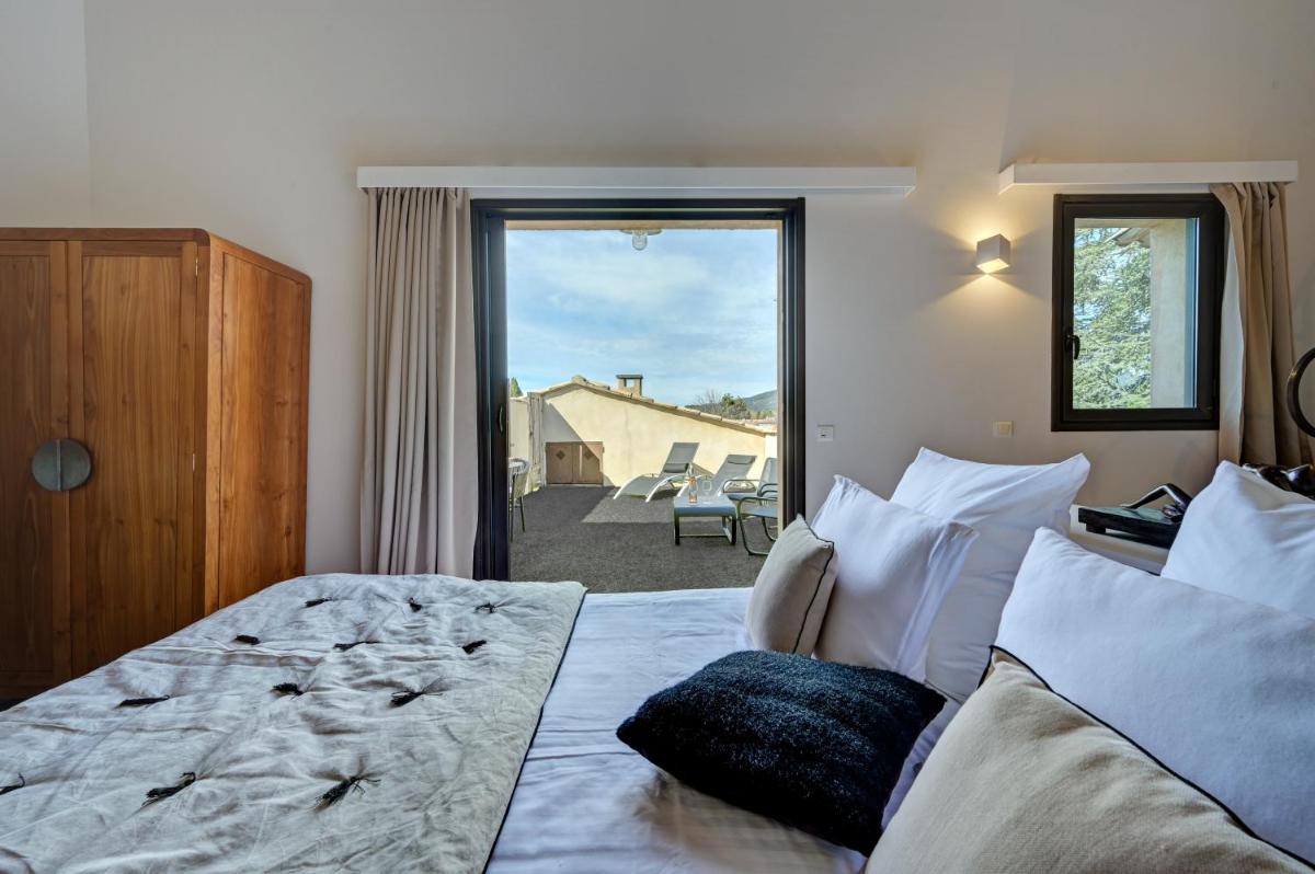 Un ou plusieurs lits dans un hébergement de l'établissement Hotel Bastide & SPA - Villa de Lourmarin