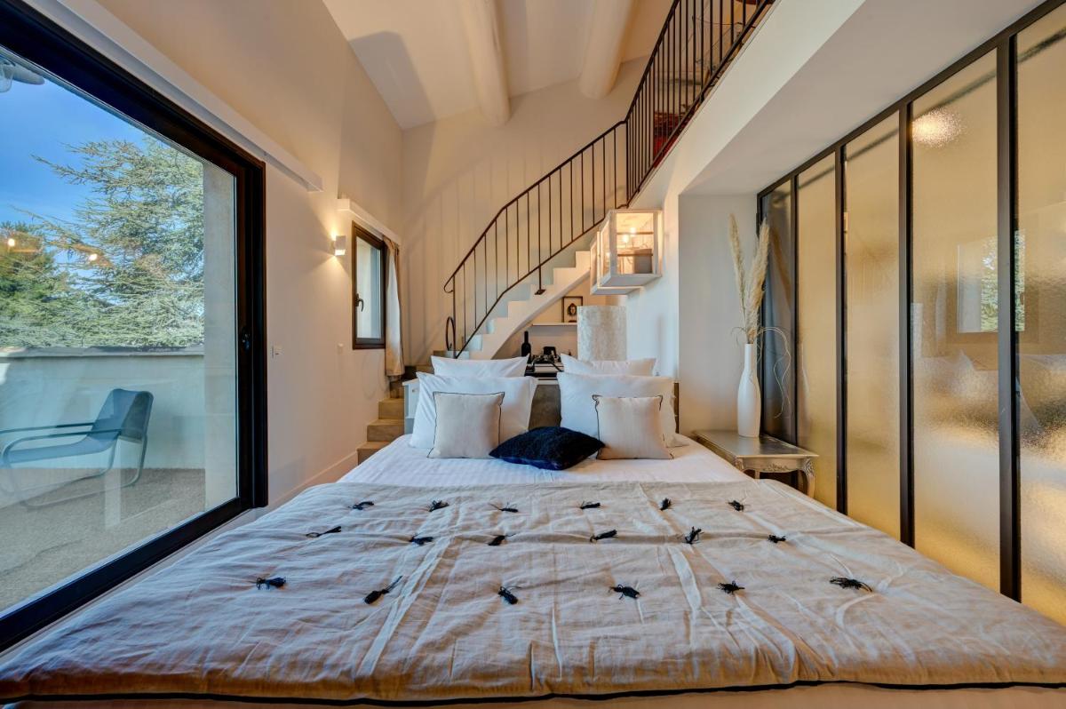 Un ou plusieurs lits dans un hébergement de l'établissement Hotel Bastide & SPA - Villa de Lourmarin