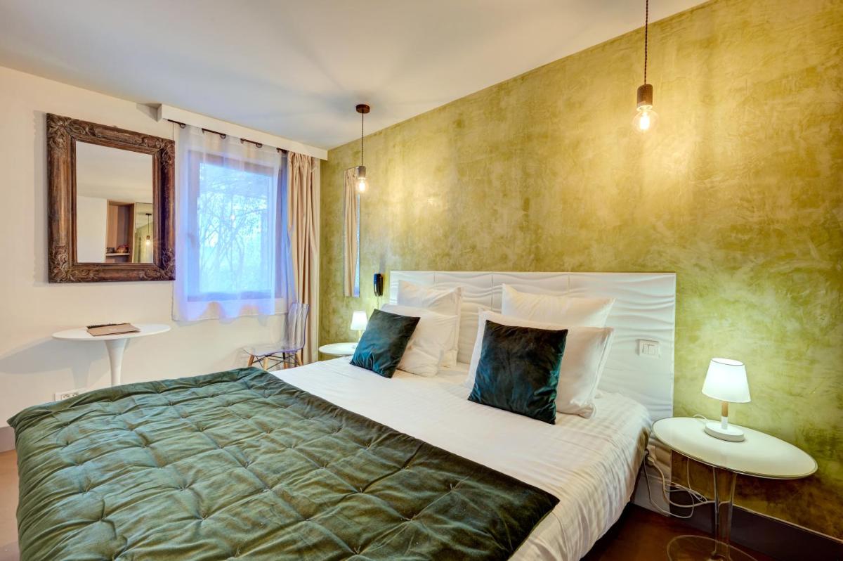 Un ou plusieurs lits dans un hébergement de l'établissement Hotel Bastide & SPA - Villa de Lourmarin