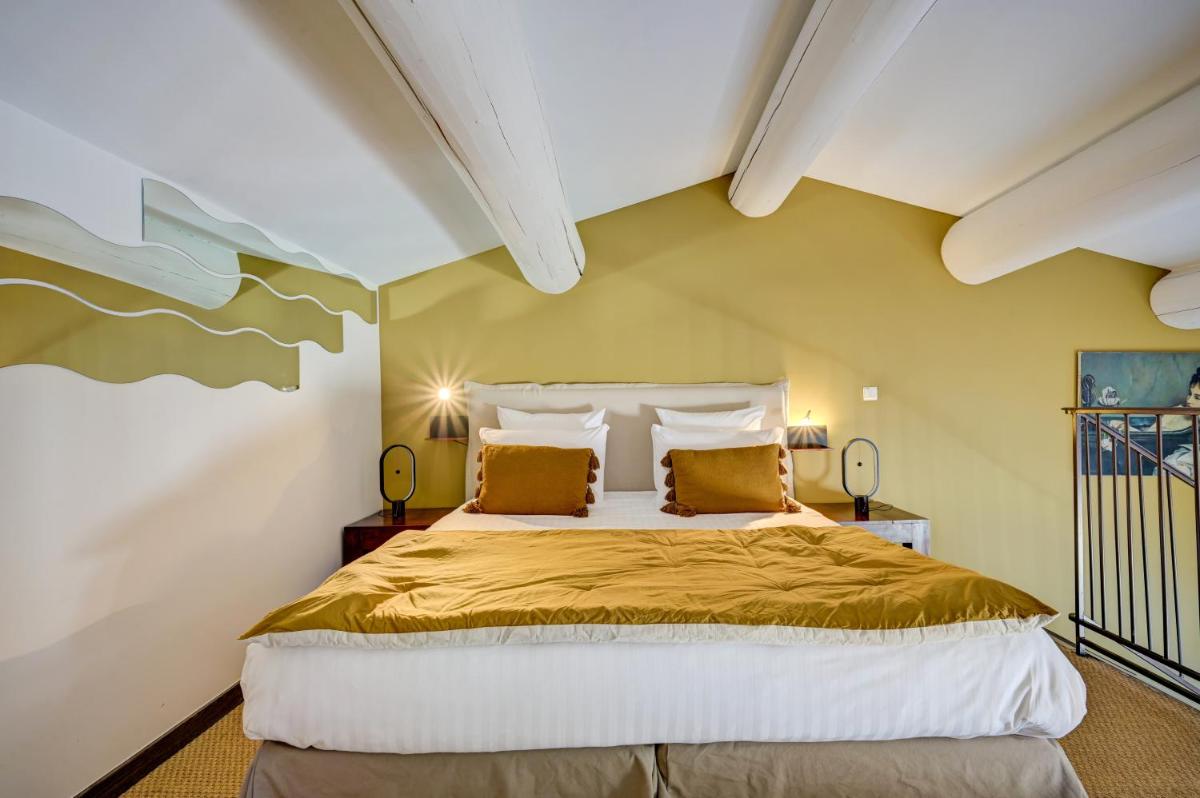 Un ou plusieurs lits dans un hébergement de l'établissement Hotel Bastide & SPA - Villa de Lourmarin