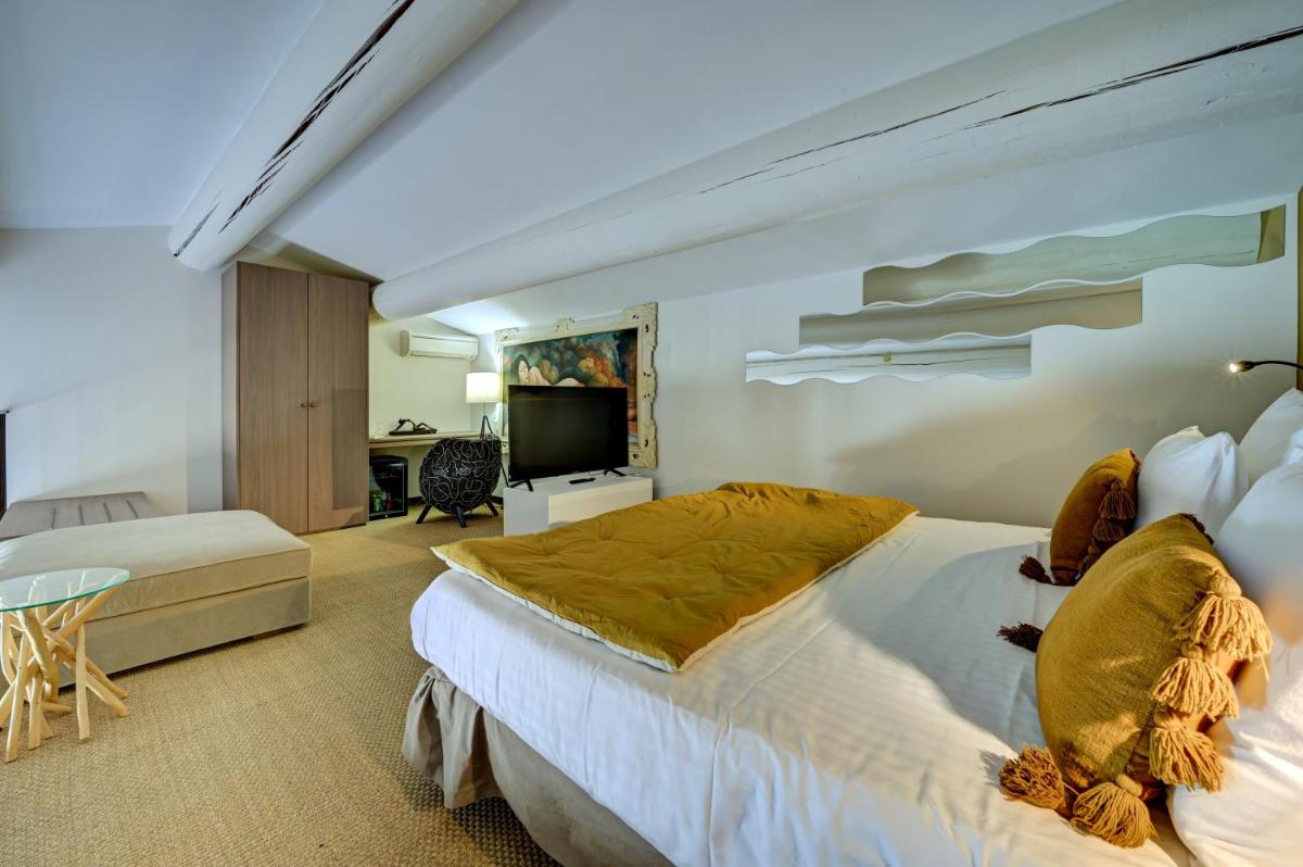 Un ou plusieurs lits dans un hébergement de l'établissement Hotel Bastide & SPA - Villa de Lourmarin