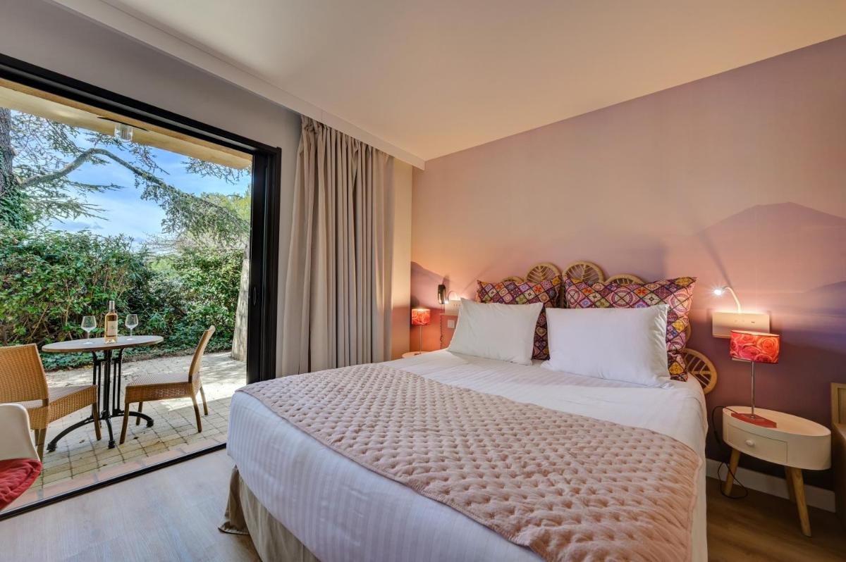 Un ou plusieurs lits dans un hébergement de l'établissement Hotel Bastide & SPA - Villa de Lourmarin