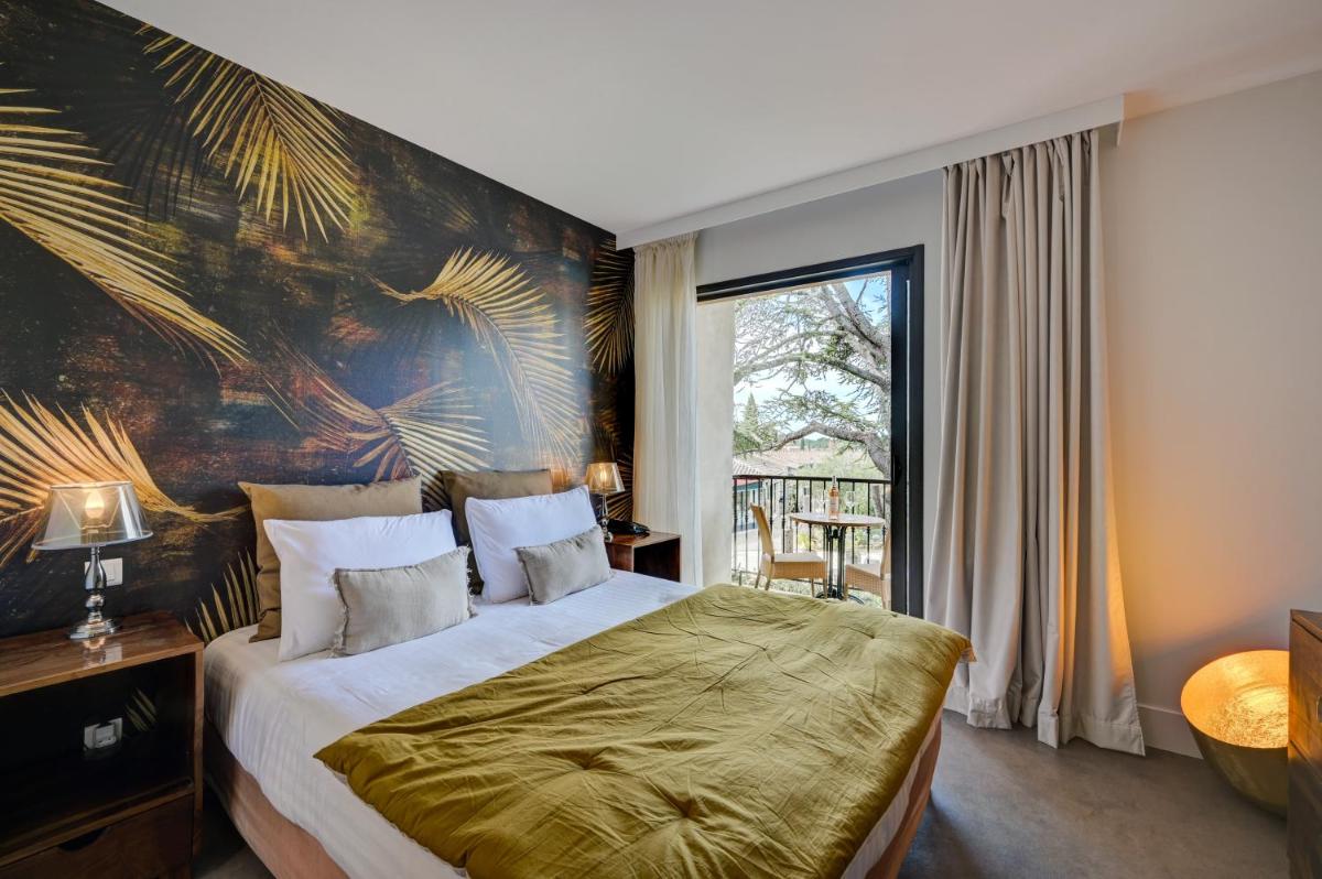 Un ou plusieurs lits dans un hébergement de l'établissement Hotel Bastide & SPA - Villa de Lourmarin