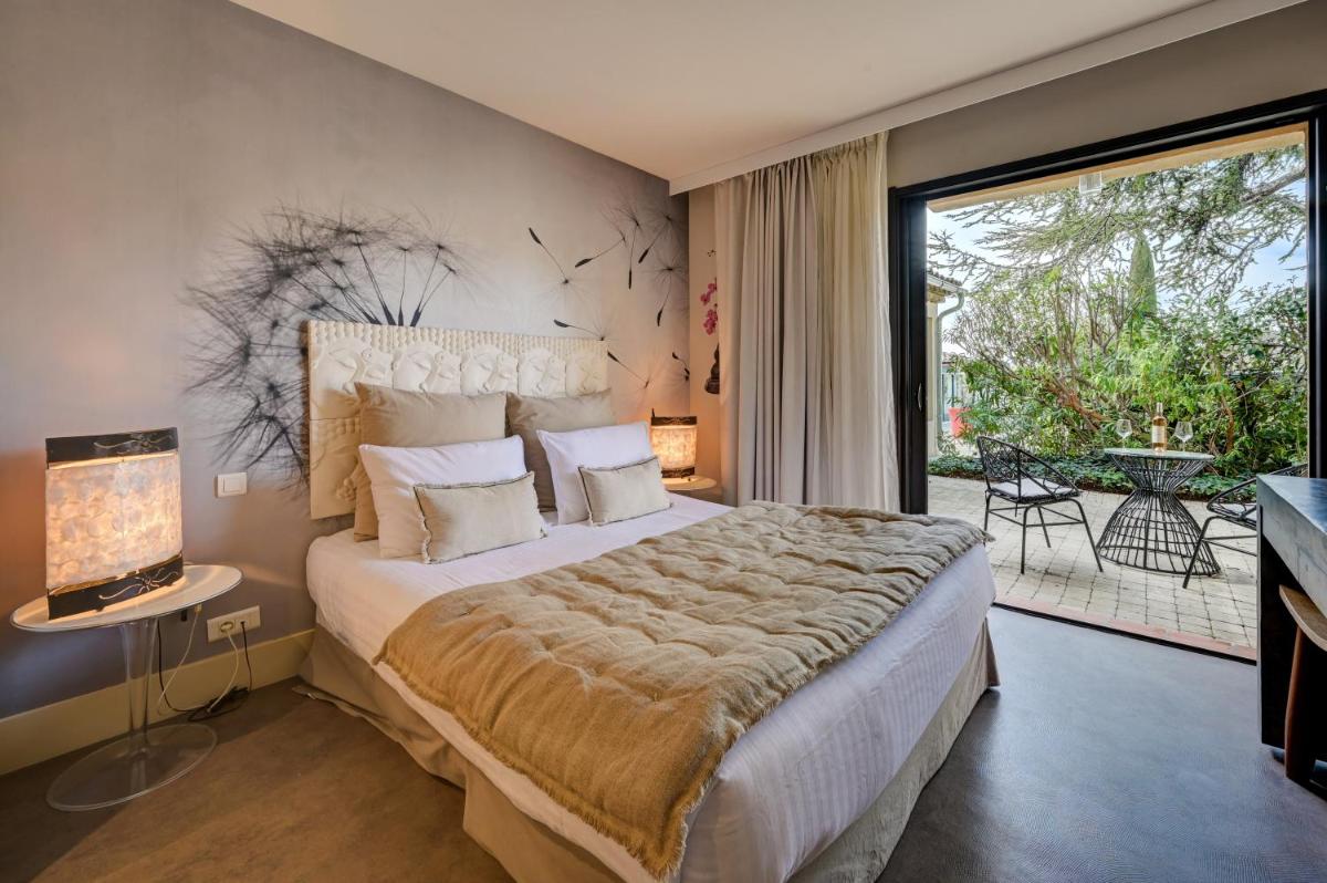 Un ou plusieurs lits dans un hébergement de l'établissement Hotel Bastide & SPA - Villa de Lourmarin