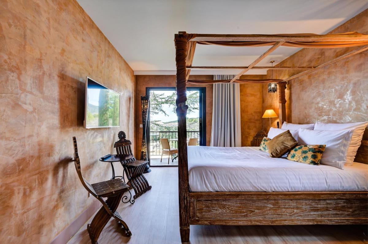 Un ou plusieurs lits dans un hébergement de l'établissement Hotel Bastide & SPA - Villa de Lourmarin
