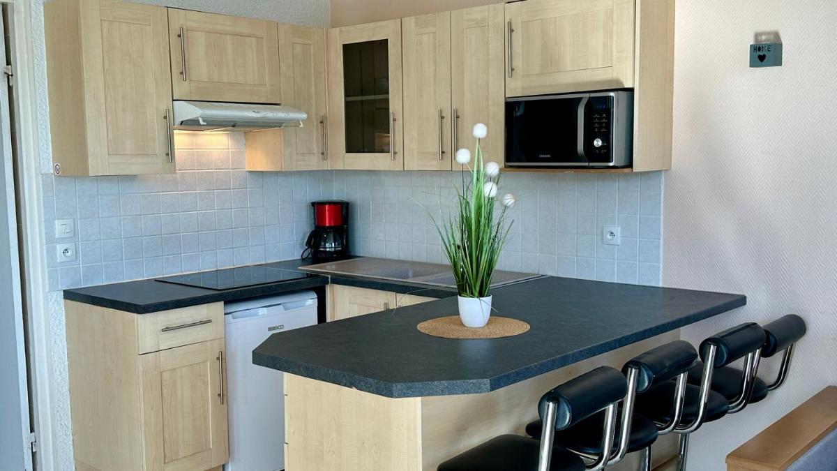 Cuisine ou kitchenette dans l'établissement La Maison Blanche