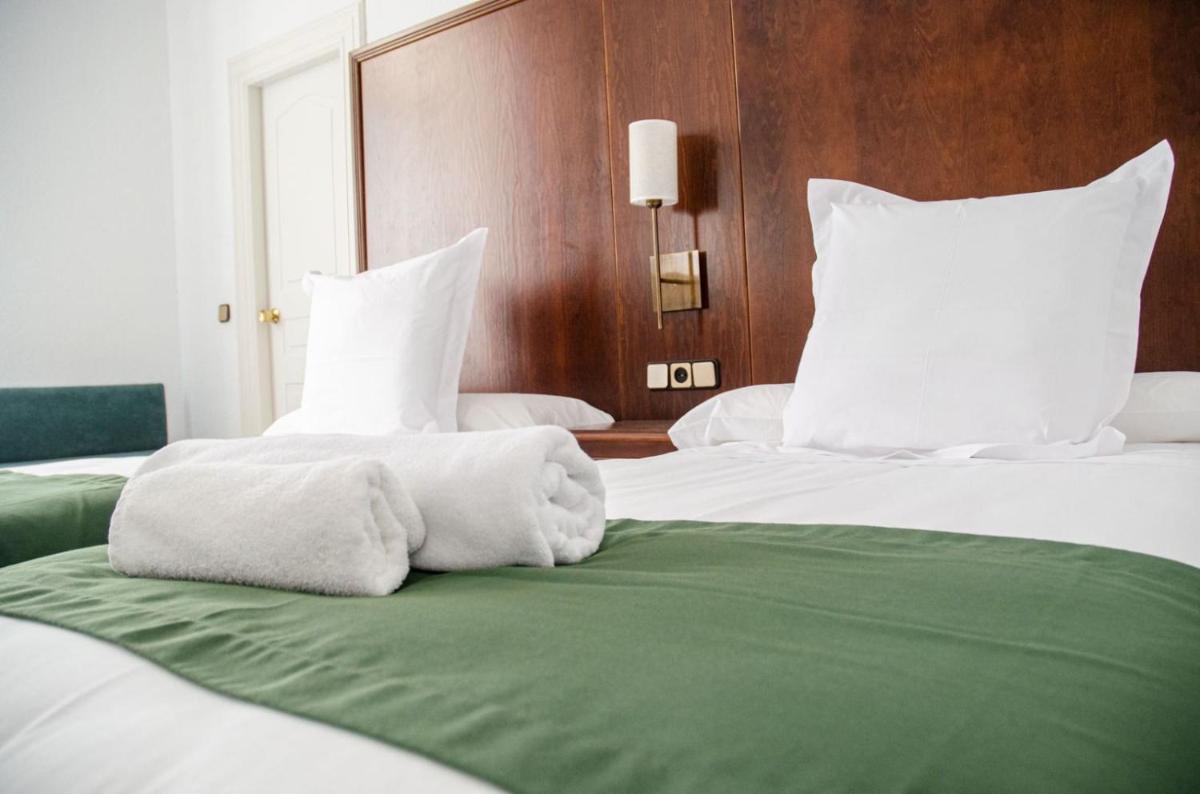 Cama o camas de una habitación en Hotel Balneario de Marmolejo