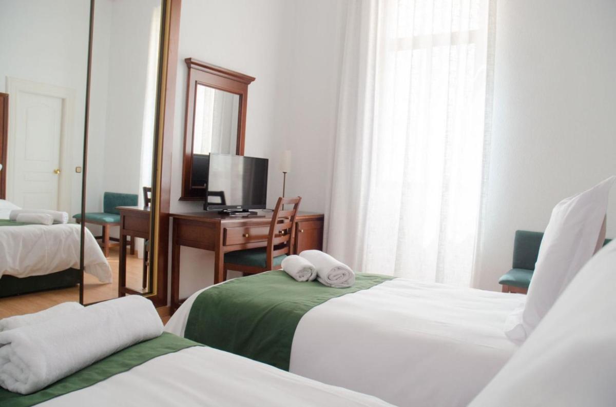 Cama o camas de una habitación en Hotel Balneario de Marmolejo