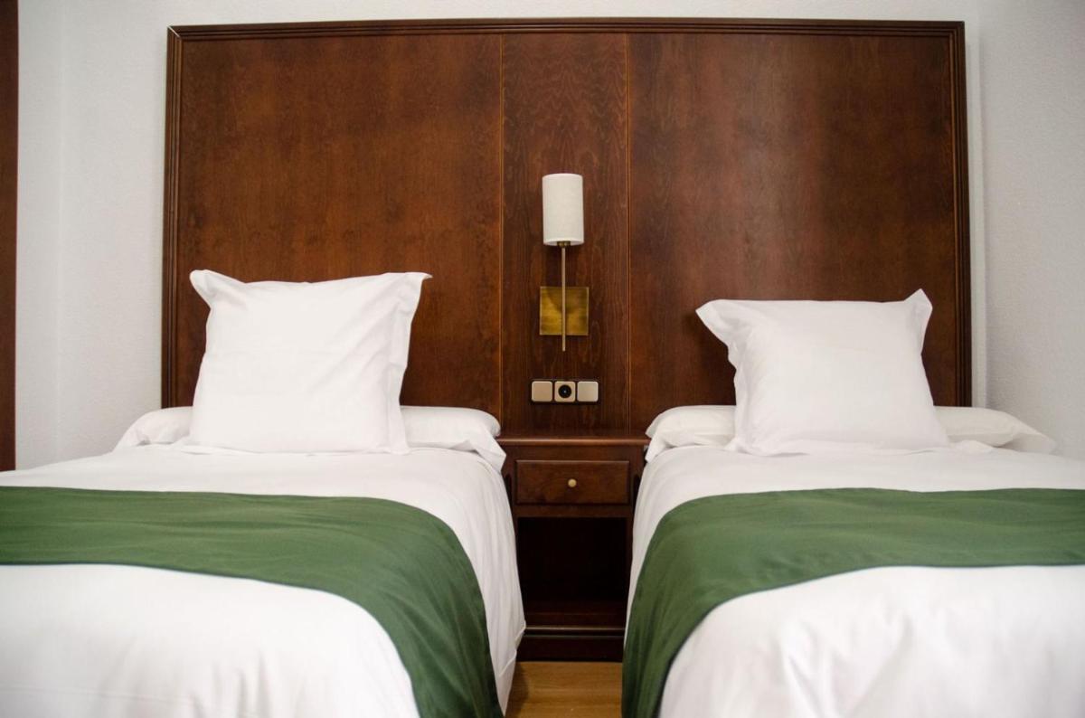 Cama o camas de una habitación en Hotel Balneario de Marmolejo