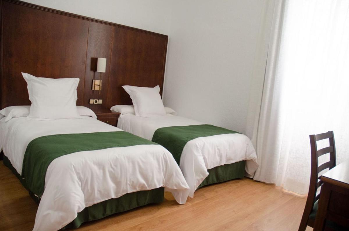 Cama o camas de una habitación en Hotel Balneario de Marmolejo