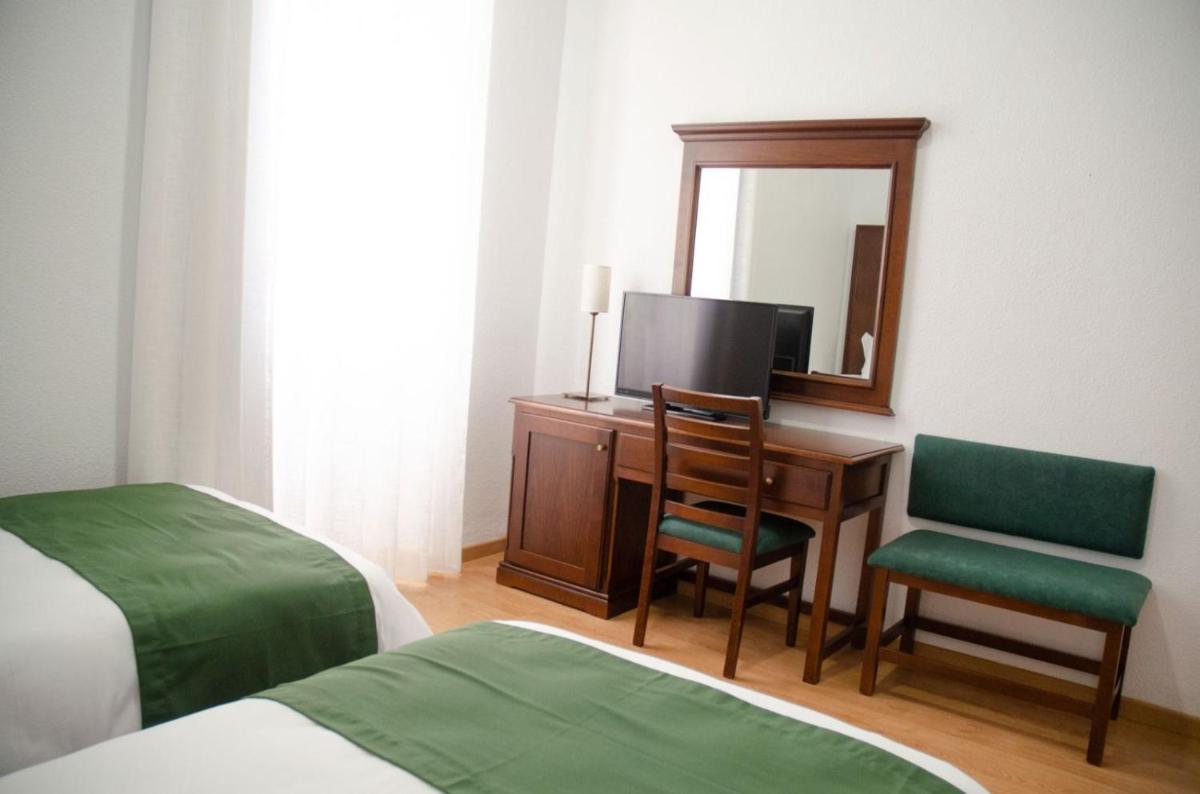 Cama o camas de una habitación en Hotel Balneario de Marmolejo