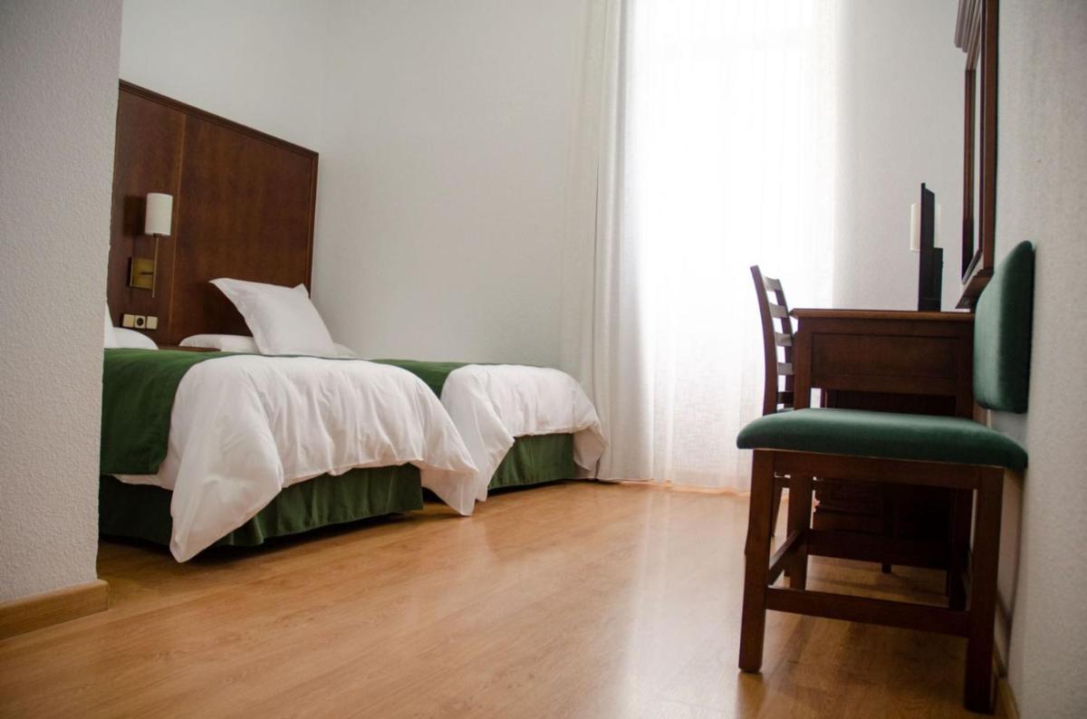 Cama o camas de una habitación en Hotel Balneario de Marmolejo