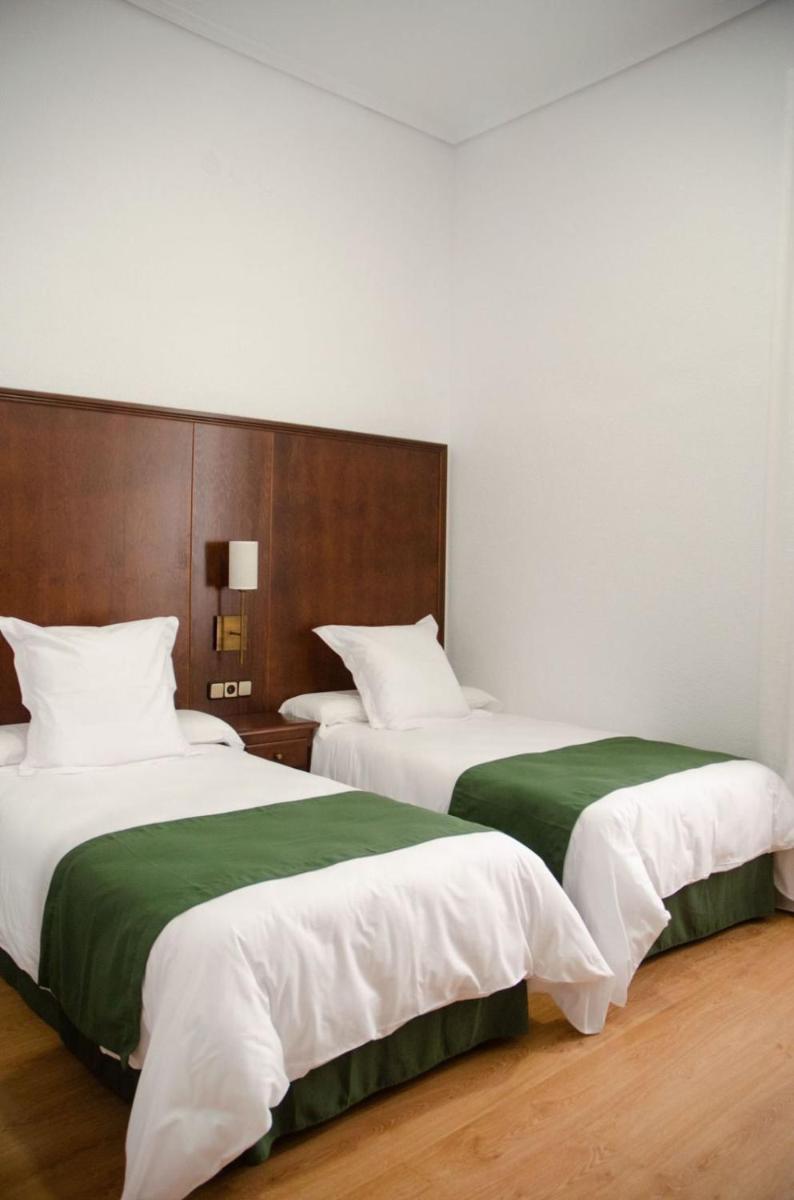 Cama o camas de una habitación en Hotel Balneario de Marmolejo