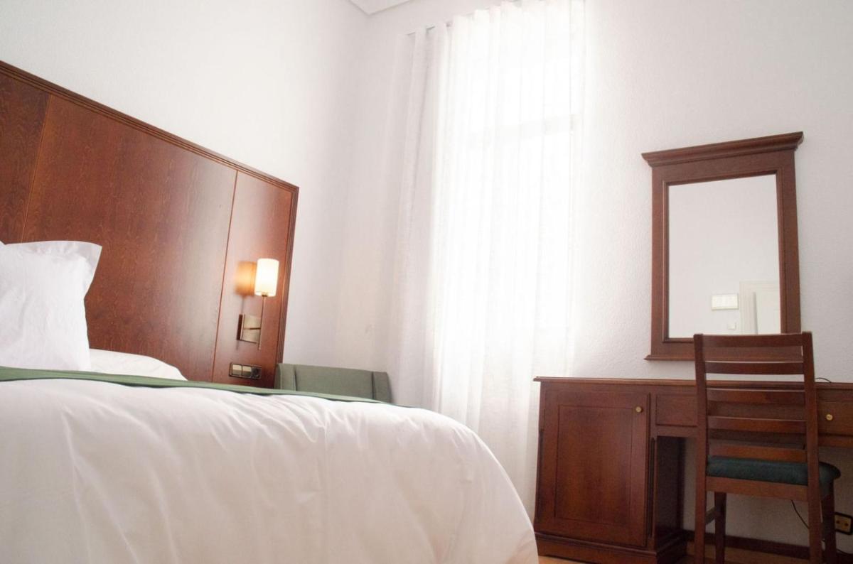 Cama o camas de una habitación en Hotel Balneario de Marmolejo