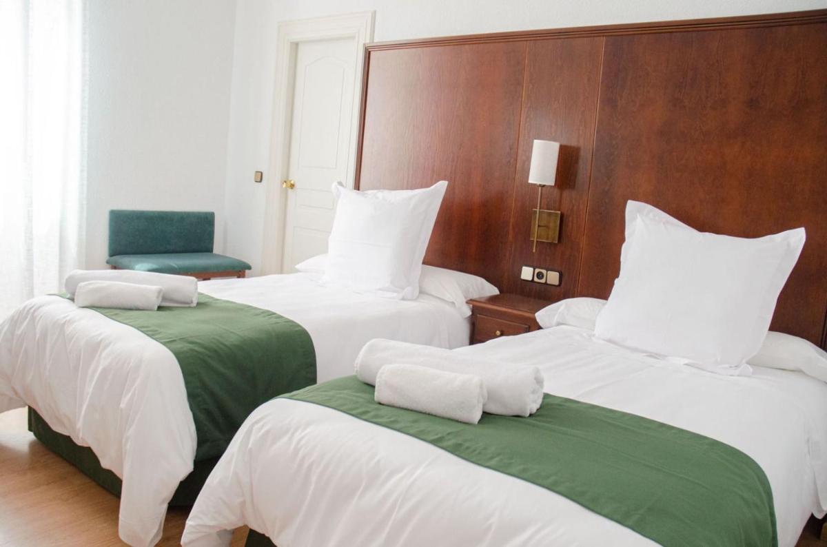 Cama o camas de una habitación en Hotel Balneario de Marmolejo